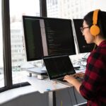 Woman coding on laptop